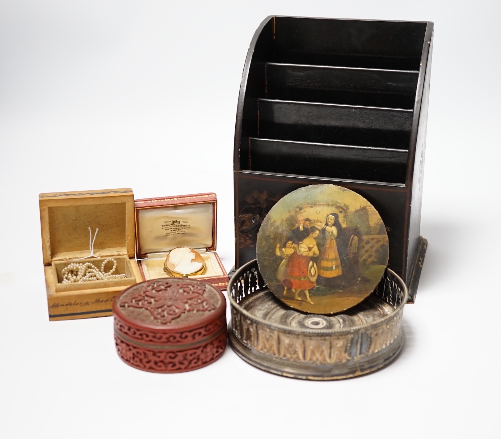 A chinoiserie lacquer letter rack, a Regency wine coaster, a seed-pearl necklace, a cameo brooch, etc.